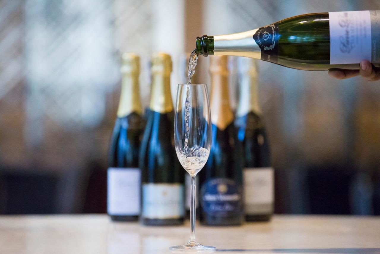 Makati Diamond Residences Makati City Exterior photo Sparkling wine being poured
